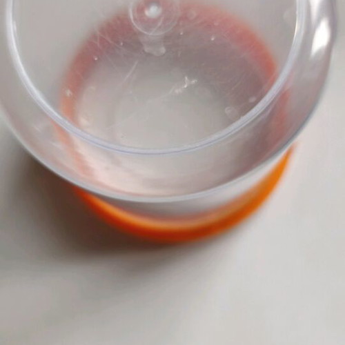 Storage container round like new, transparent with orange lid