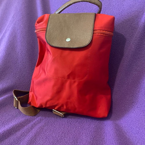 Everyday red backpack like new with brown details