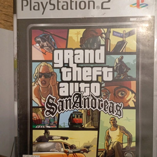 PlayStation 2 console with 3 and 4 games, used