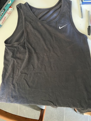 Nike sleeveless shirt used with slight sun discoloration, size M, black and blue