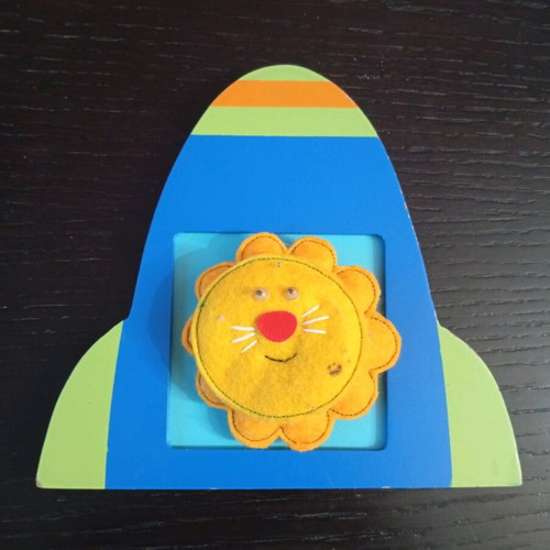 Handmade felt activity with lion in wooden frame used