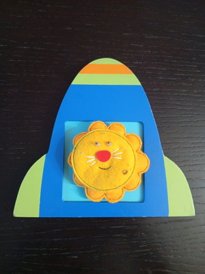 Handmade felt activity with lion in wooden frame used