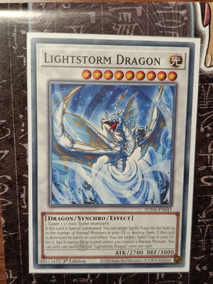 Lightstorm Dragon card like new with Ultra Pro sleeve