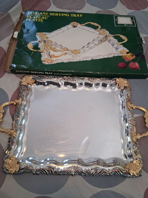 Elegant serving tray with golden handles