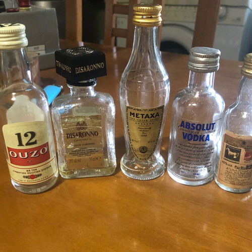 Glass miniature bottles used, pack of 7, vintage spirit collection