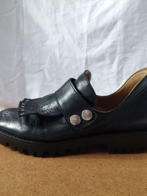 Women's black leather loafers with tassels and snap buttons, size 37