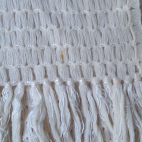 Knitted white scarf used with slight yellowing