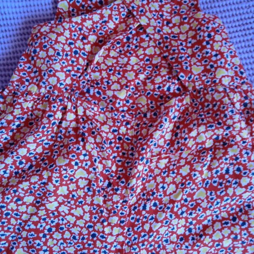 Red salopette with patterns for 3 years like new