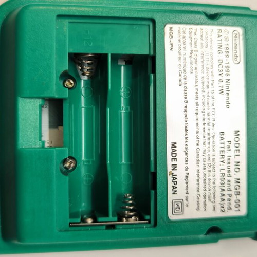 Game Boy Pocket Green console used with Test Drive 6 game