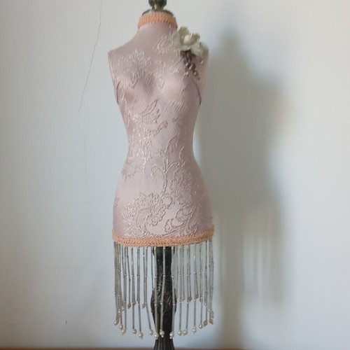 Decorative body like new with embossed designs and fringes