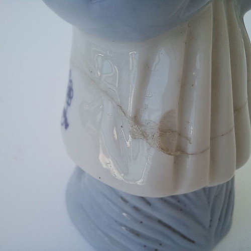 Porcelain figurine used with peasant girl