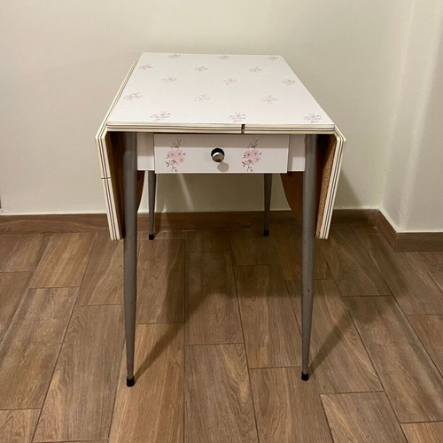 Formica kitchen table used, extendable with almond blossom design and drawer