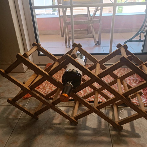 Reclining wooden wine rack used