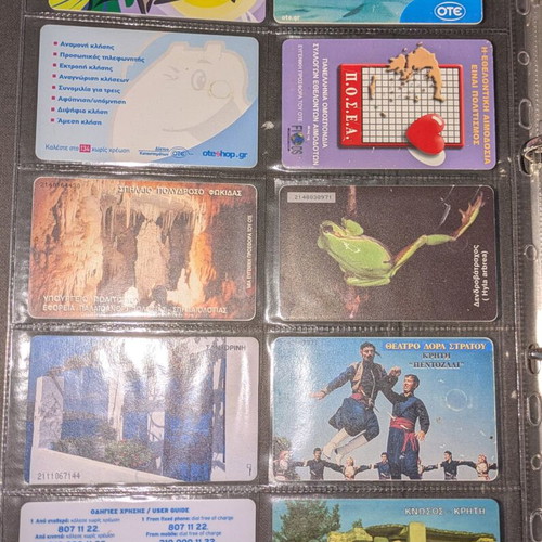 Black folder like new with 25 phone cards and cards