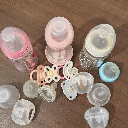 Baby bottles and pacifiers used set
