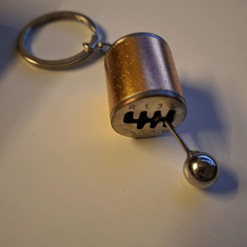Gear shift lever keychain like new, orange and silver