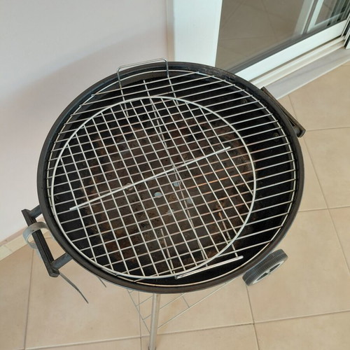 Grill with tongs used