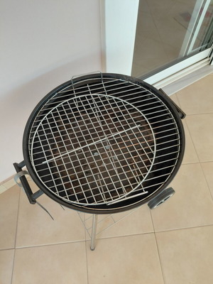 Grill with tongs used