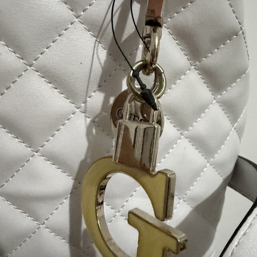 Guess Backpack white like new with silver details and charm
