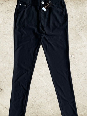 Elastic black pants new, fitted with metallic accessories and pockets