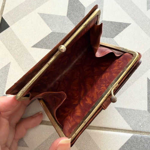 Vintage brown leather wallet used with frame closure