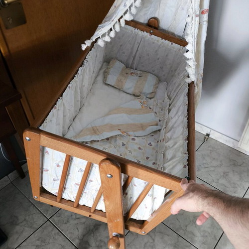 Wooden baby cot like new with wheels and mosquito net