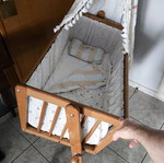 Wooden baby cot like new with wheels and mosquito net