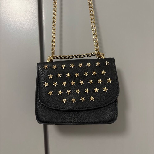 Shoulder bag with gold stars and chain like new, black