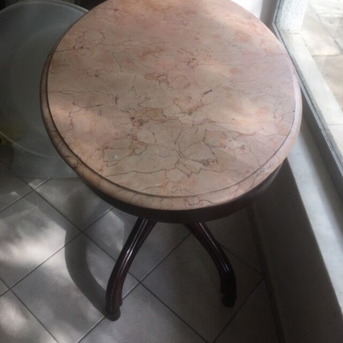 Vintage table with bent wood and oval salmon-pink marble used