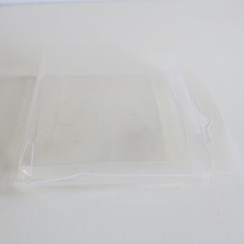 Plastic transparent cases used for figures and Game Boy