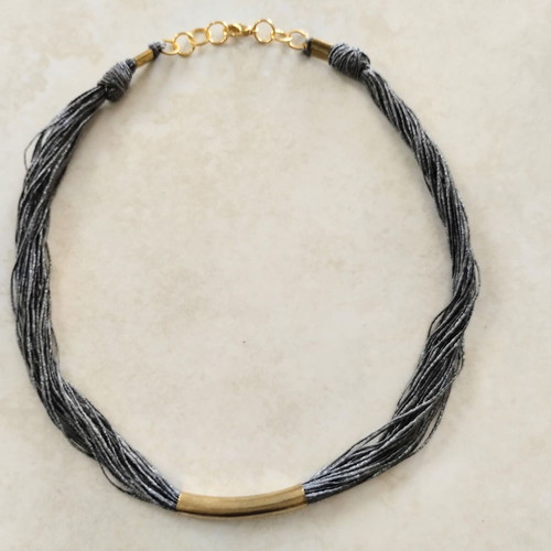 Minimal handmade necklace used, silk thread with metal element