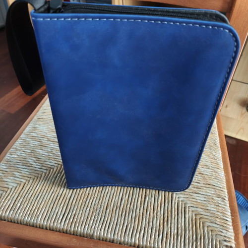 Coin album with 200 slots, zipper closure, strap
