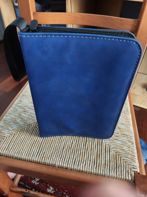 Coin album with 200 slots, zipper closure, strap