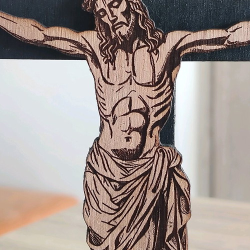 Handmade cross with embossed Jesus figure on laser cut wood