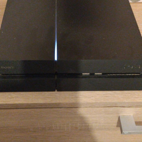PlayStation 4 like new with 2 controllers and 4 games