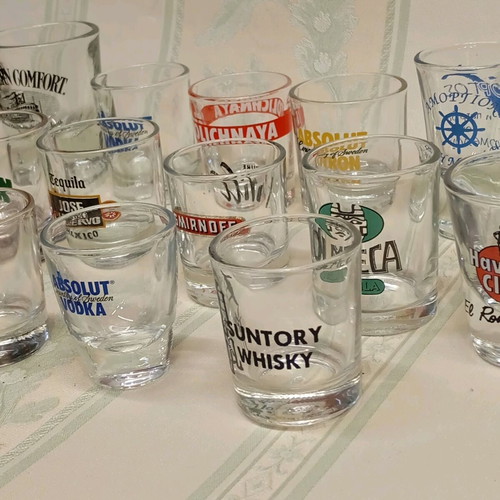 Collection of 87 shot glasses new, promotional and collectible