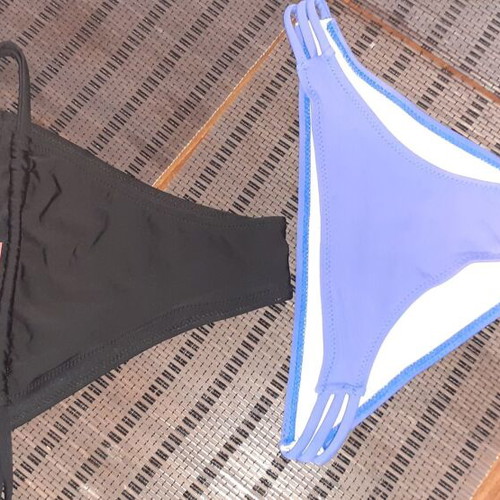 Two women's swimsuits new, one blue and one black, sizes XS and S