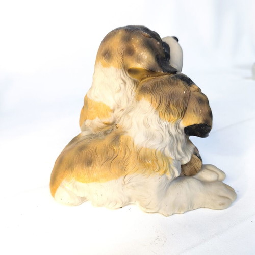 Decorative resin figurine of two puppies used
