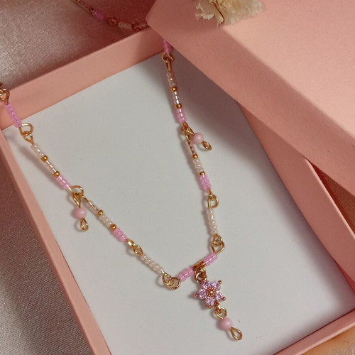 Necklace with white and pink beads and crystal flower