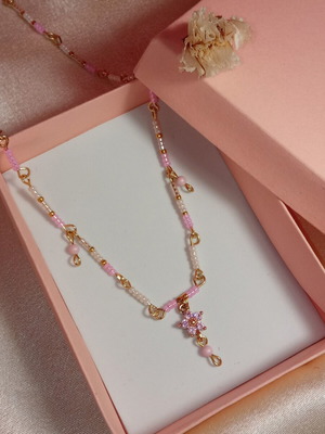 Necklace with white and pink beads and crystal flower