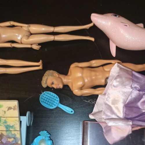 Barbie and other toys used, in moderate condition