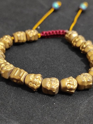 Buddha Bracelet with Small Buddha Beads Hematite like new, gold-colored