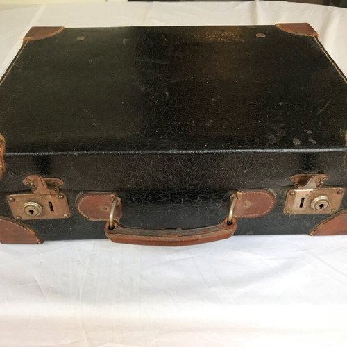 Small antique suitcase used with wear