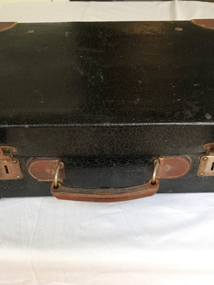 Small antique suitcase used with wear
