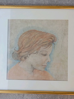 Artwork used, wood and paint on cardboard with human head theme