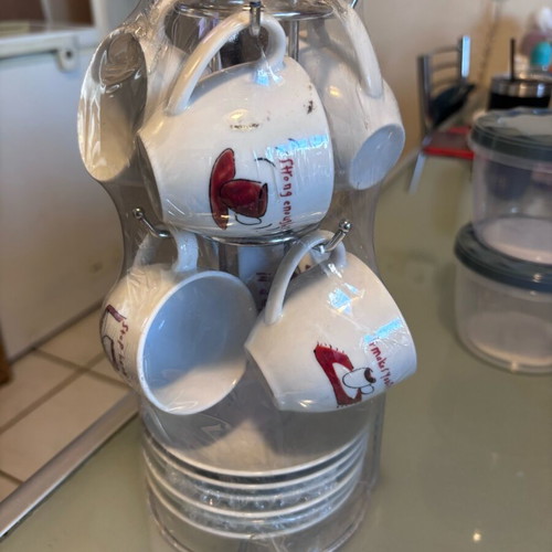 Set of 6 cups new with saucers and stand