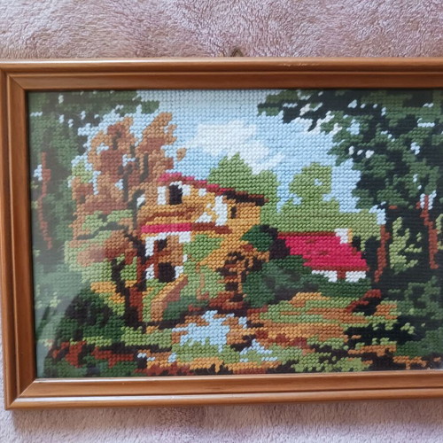 Embroidered textile painting in frame like new, house in forest