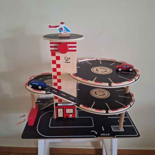 Hape wooden three-level car garage with elevator and vehicles