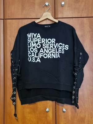 Black sweatshirt used with unique sleeves and asymmetrical design