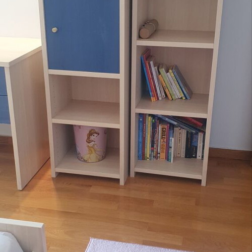 Blue bedroom set with desk, bookshelves and bed